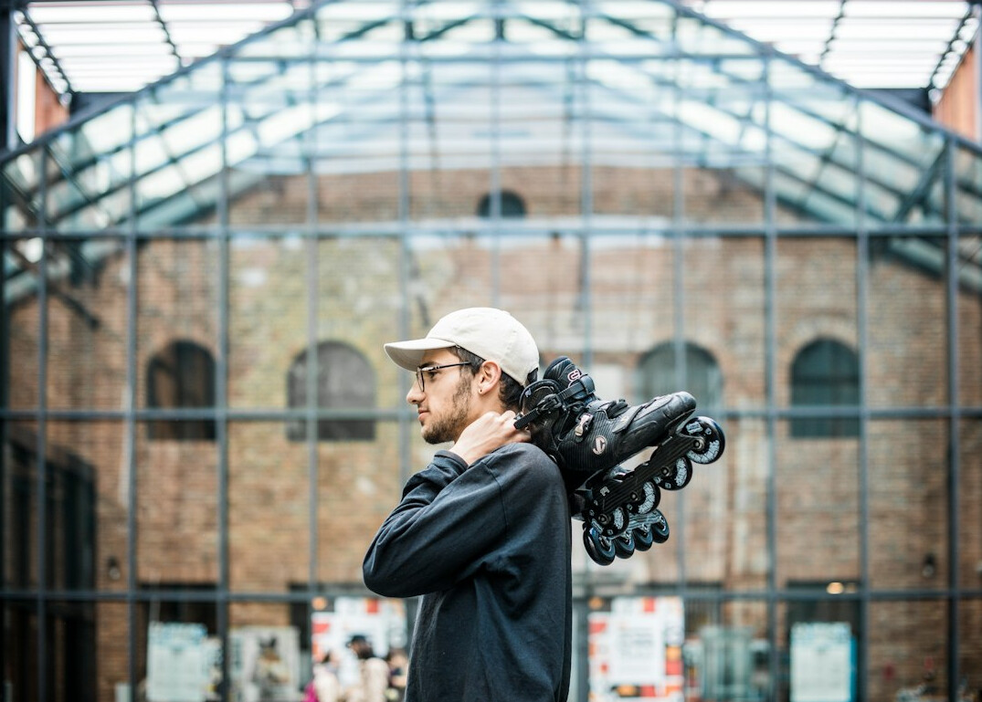 Portrait of a cinematographer holding a camera rig